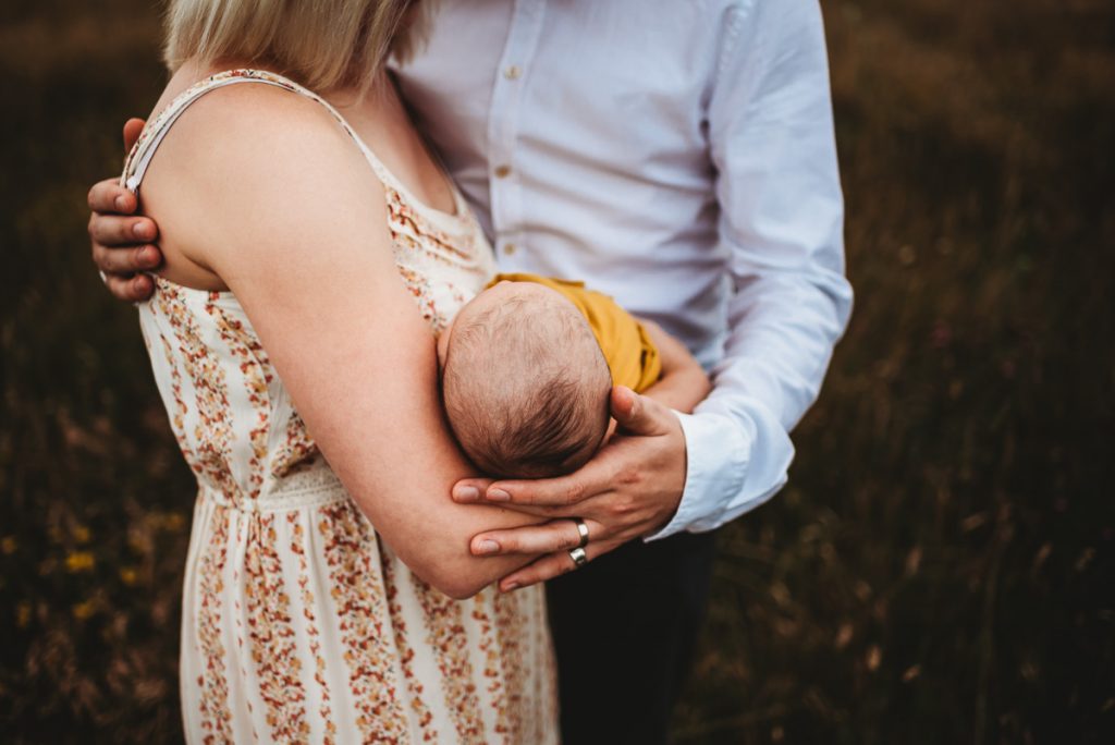 Outdoor newborn photography at sunset