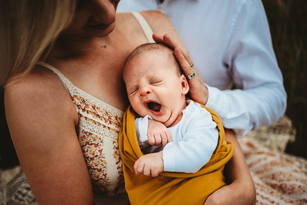 a newborn baby yawning