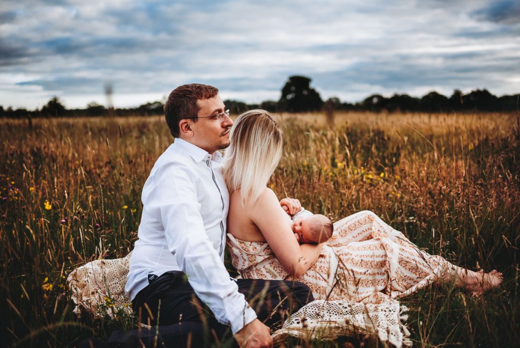 outdoor newborn photography session during sunset
