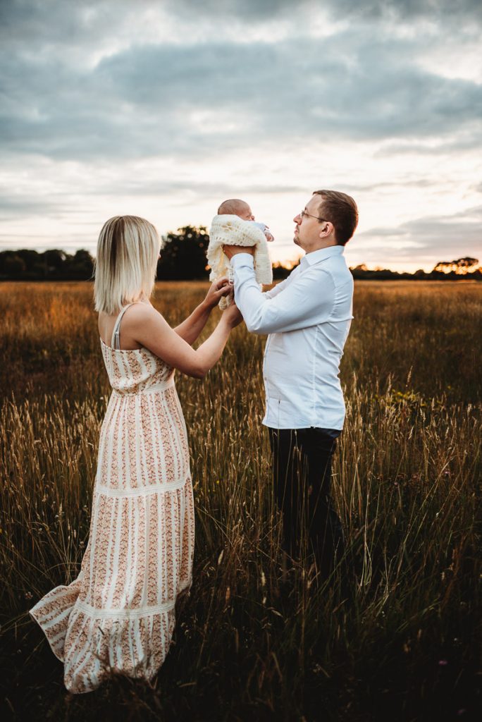 outdoor newborn photography during sunset