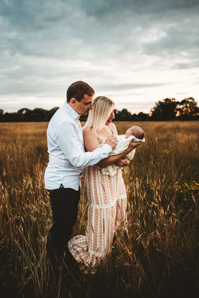 Outdoor newborn photography during sunset