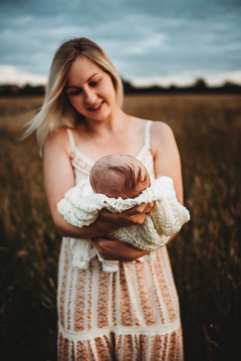 outdoor newborn photography during sunset