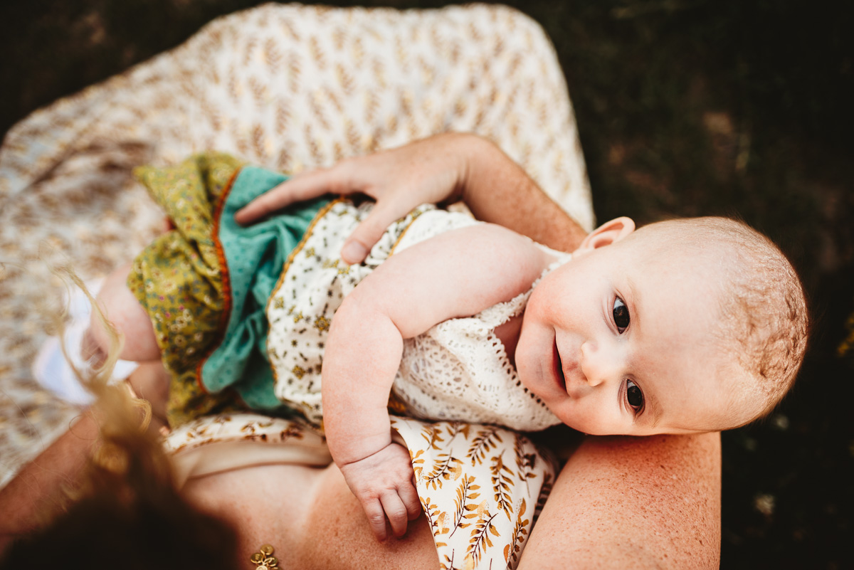 birds eye view of a baby in her mothers arms