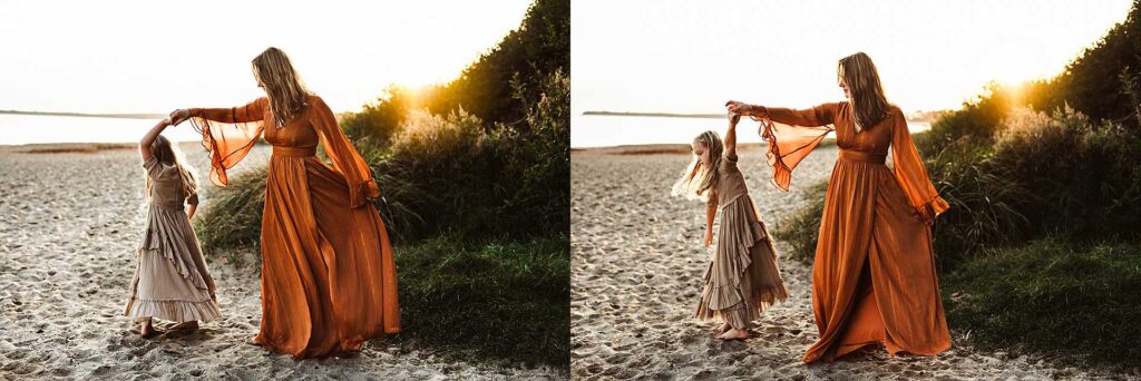 mother and daughter dancing on the beach during sunset