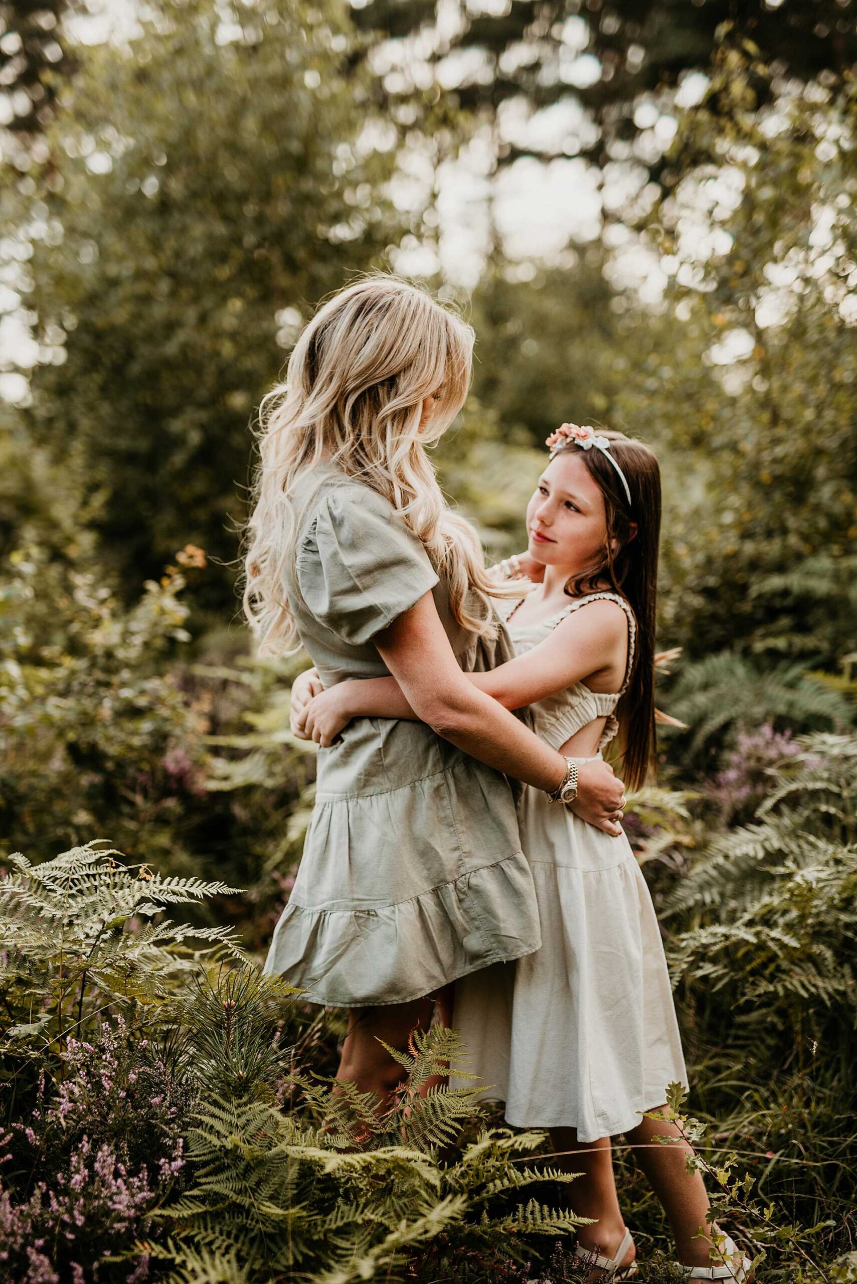 mother and daughter standing amongst the fears at Snelsmore Common