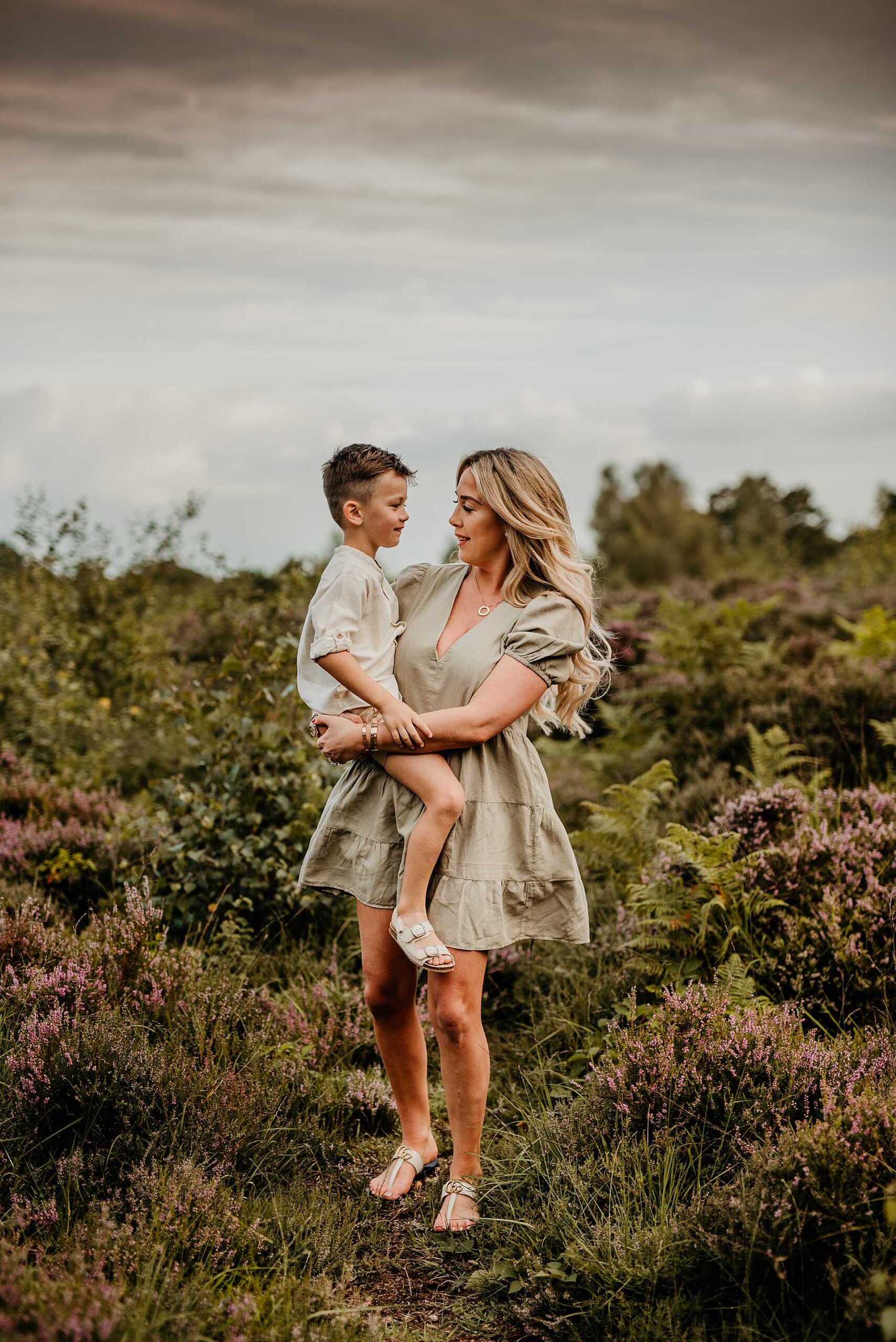 mother holding her son in the purple heather
