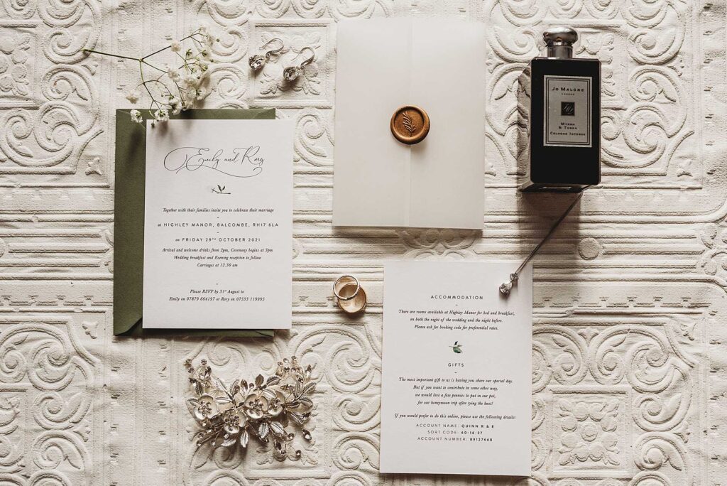 flat lay of wedding invites and the brides details