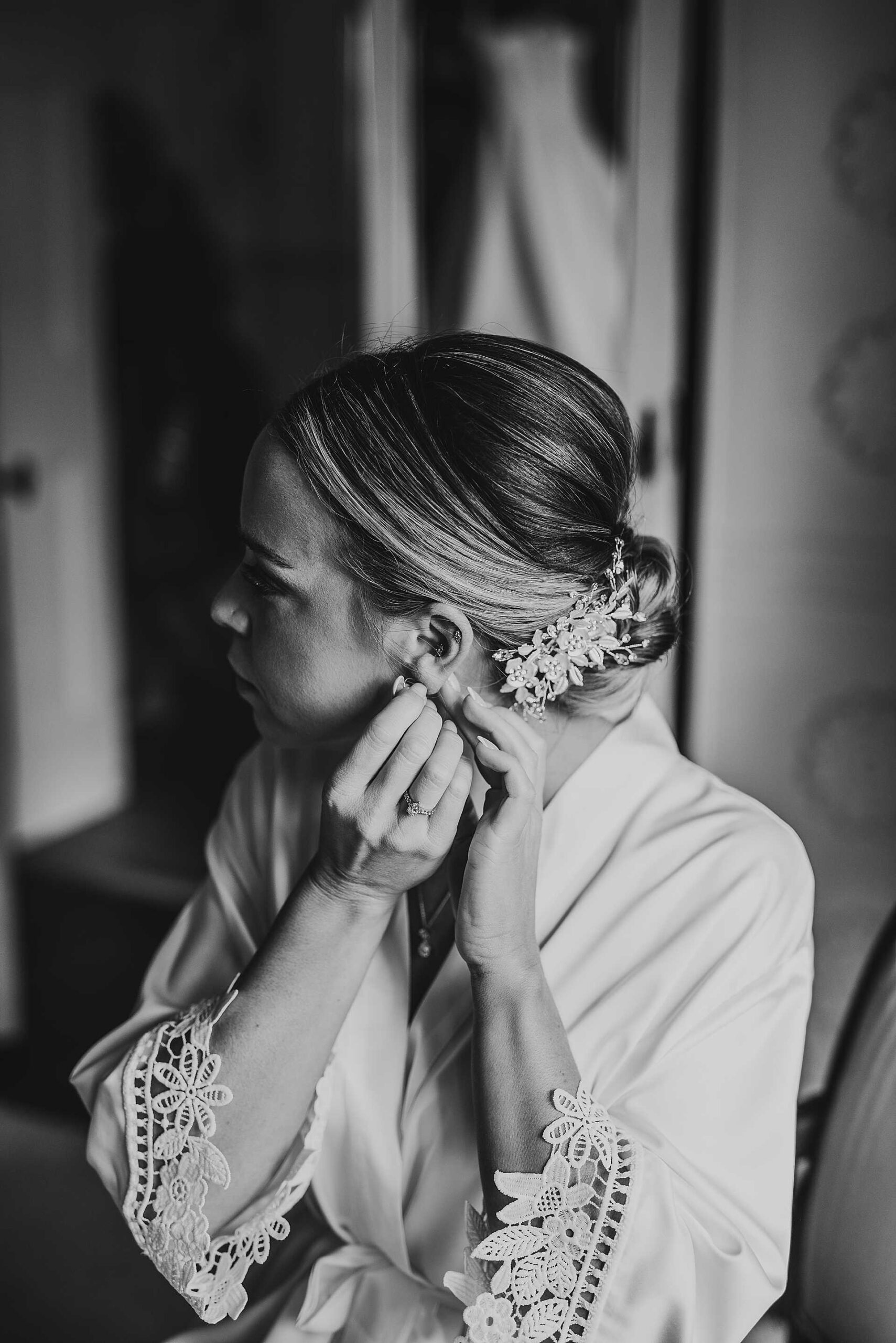 black and white image of bride putting her earnings in