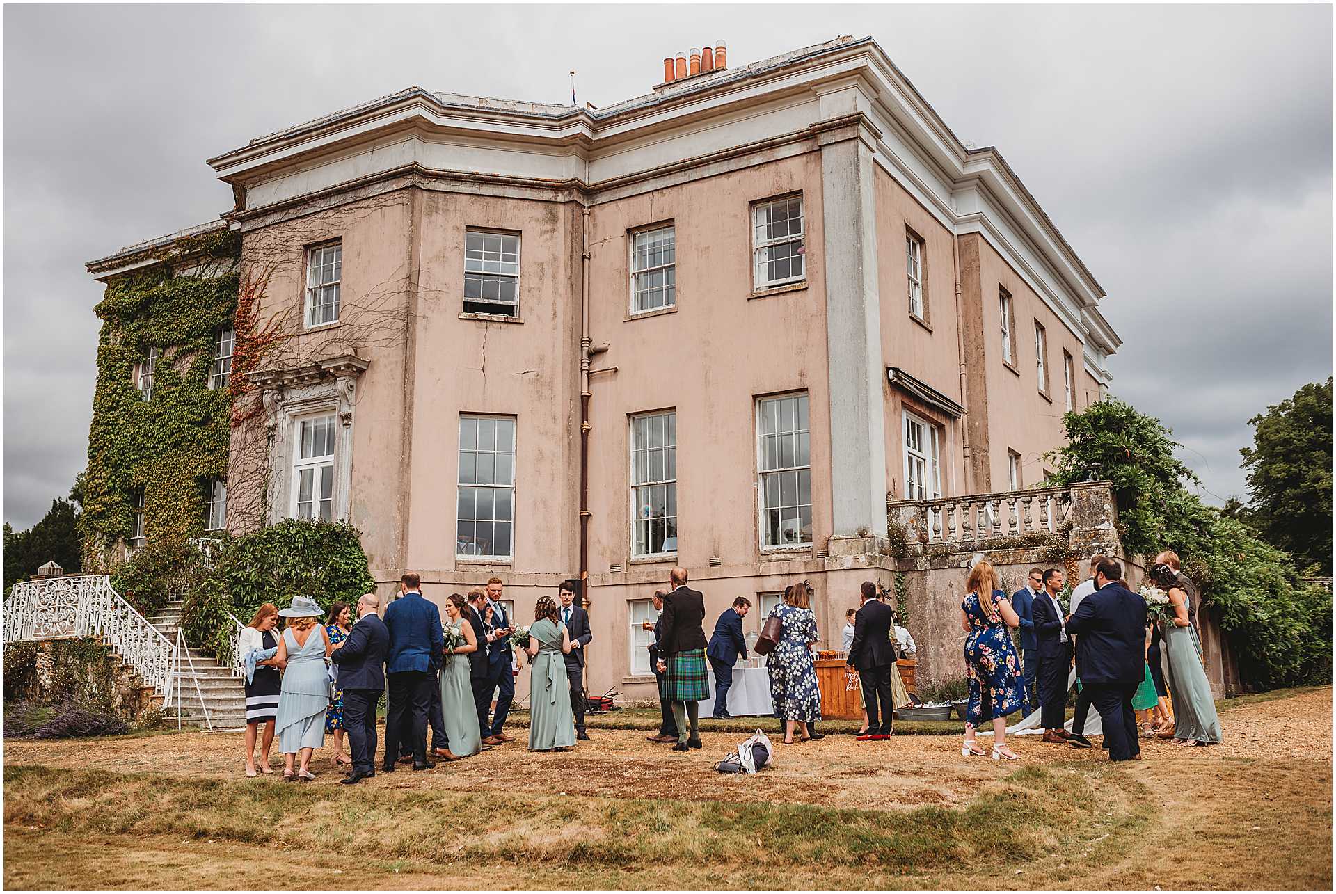 guests on the lawn at hale park wedding venue