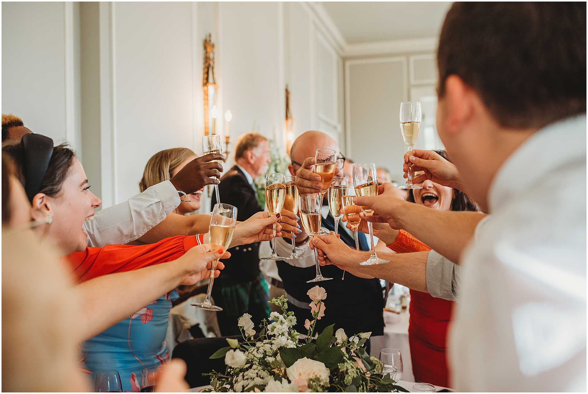 guests toasting glasses during speeches at hale park in Hampshire