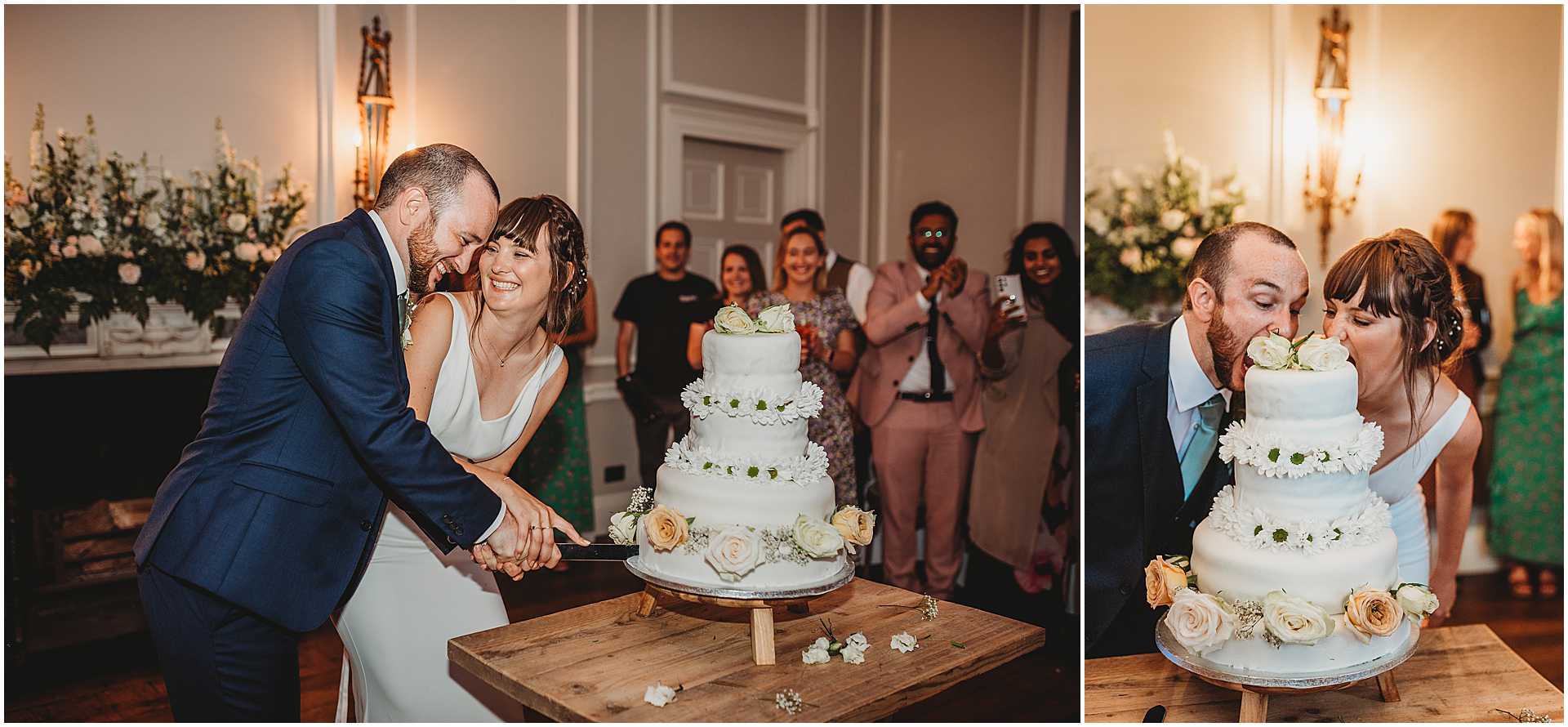 bride and groom cutting their cake whilst the guests watch