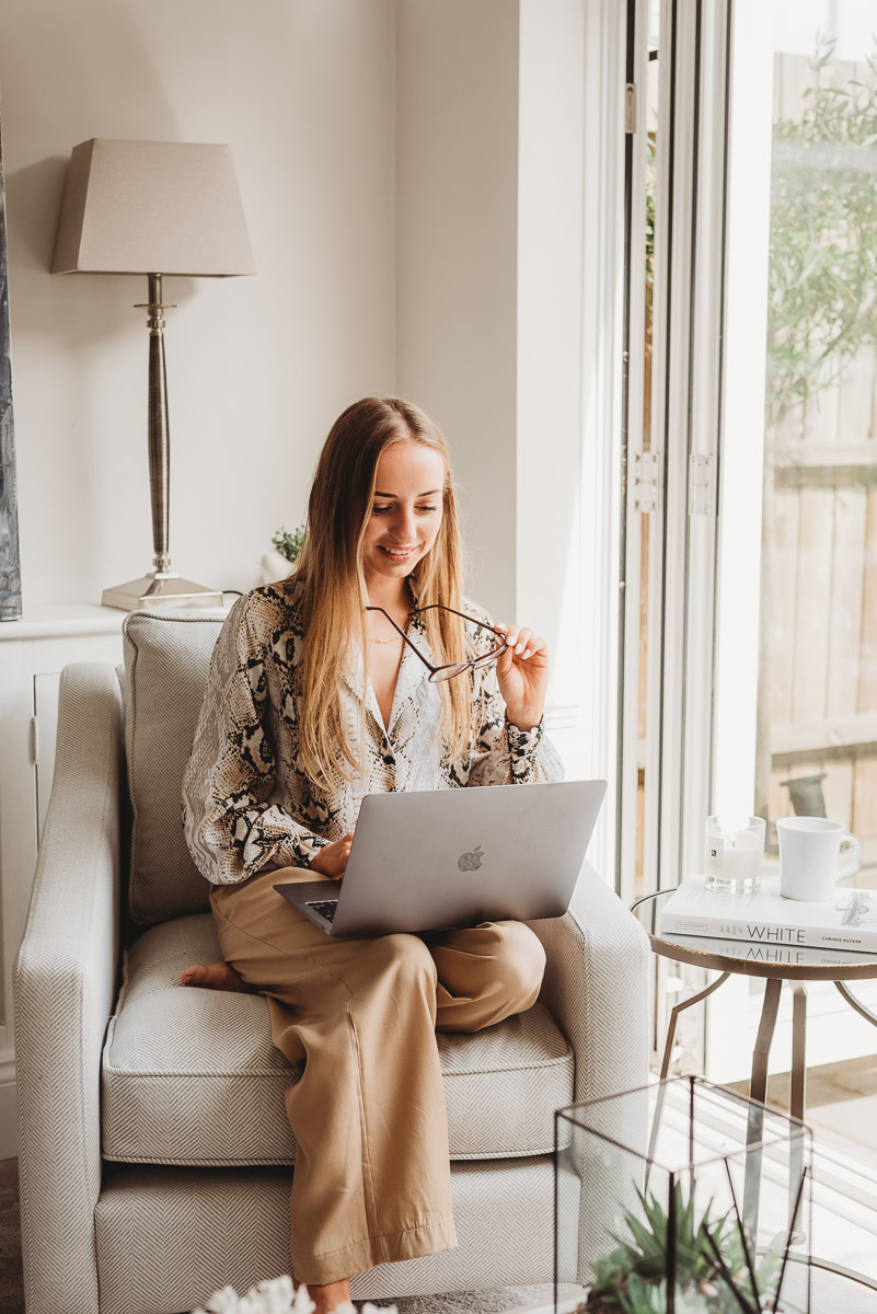 girl working on laptop and drinking coffee