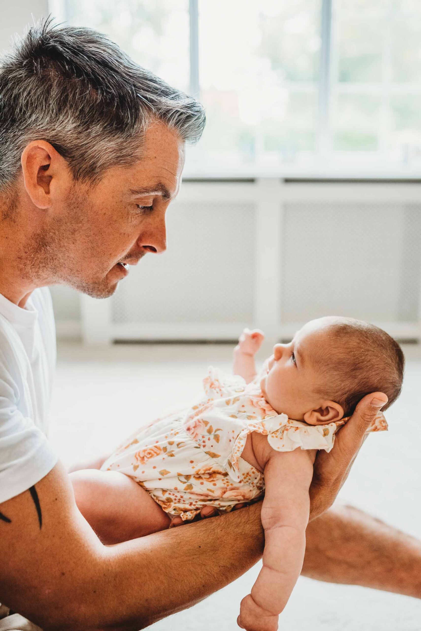 father and newborn daughter