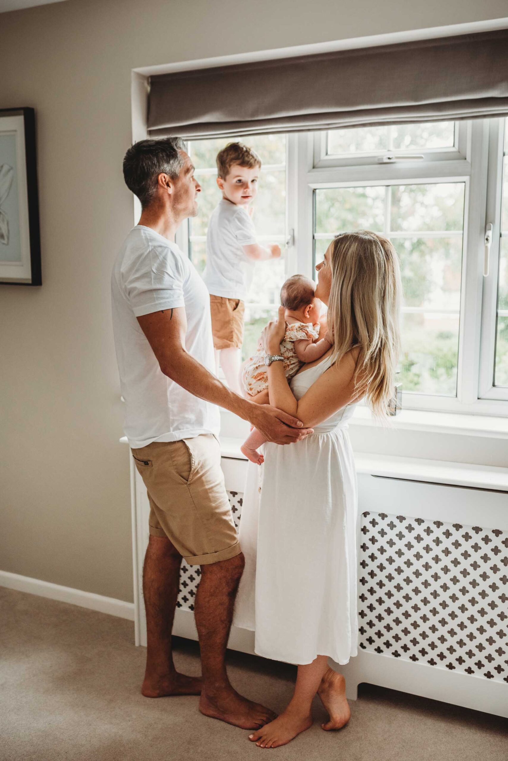 mother and father with little boy and newborn baby