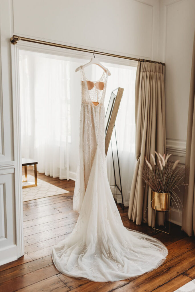 brides dress hanging up in the bridal suite at Syrencot house