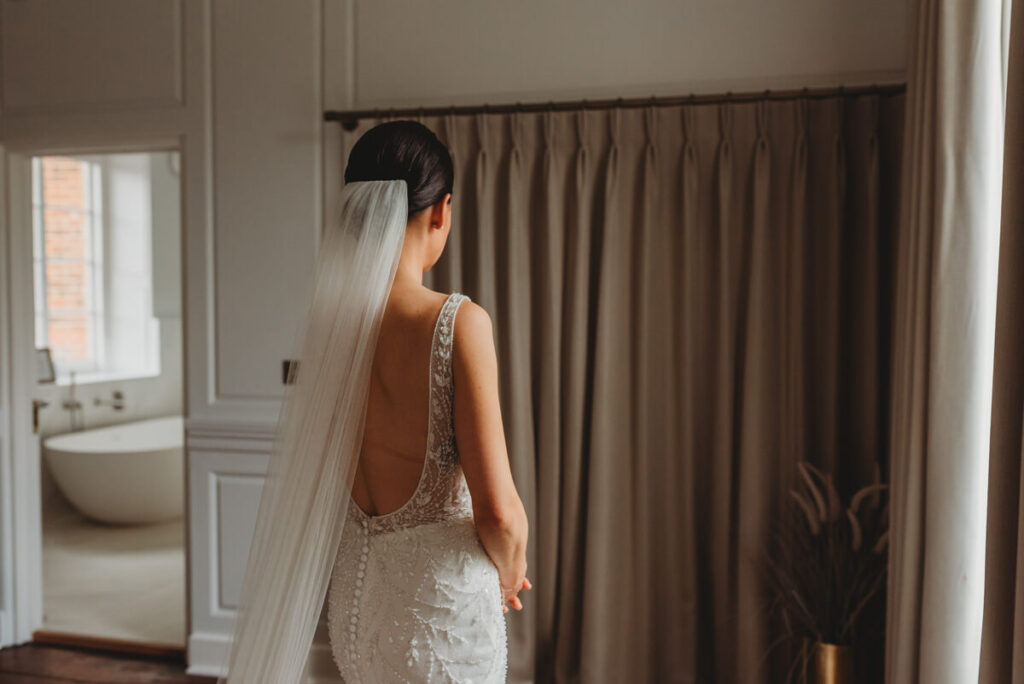 bride waiting for the first look with her father t Syrencot house
