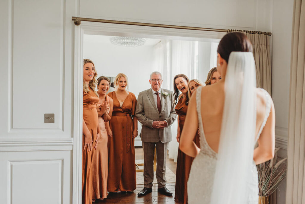 dress reveal with father of the bride and bridesmaids at Syrencot house bridal suite