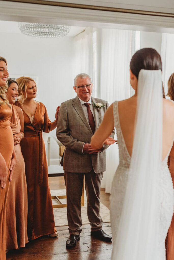 dress reveal with father of the bride and bridesmaids at Syrencot house bridal suite