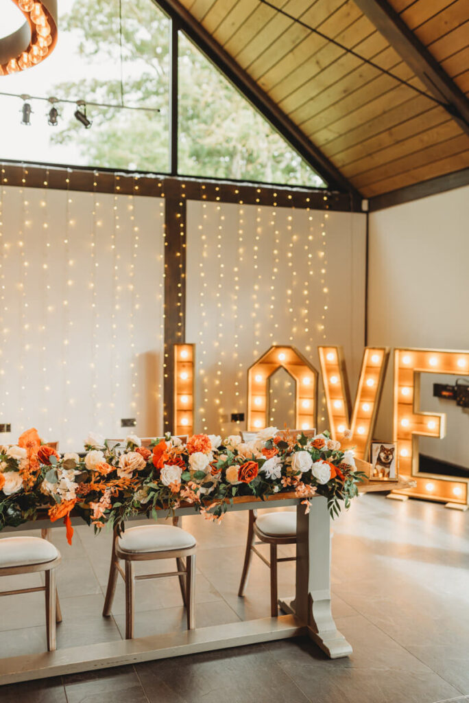 reception room set up with LOVE letters on the dancefloor by Wedding Photographer in Wiltshire, the Cotswolds, Gloucestershire and beyond.