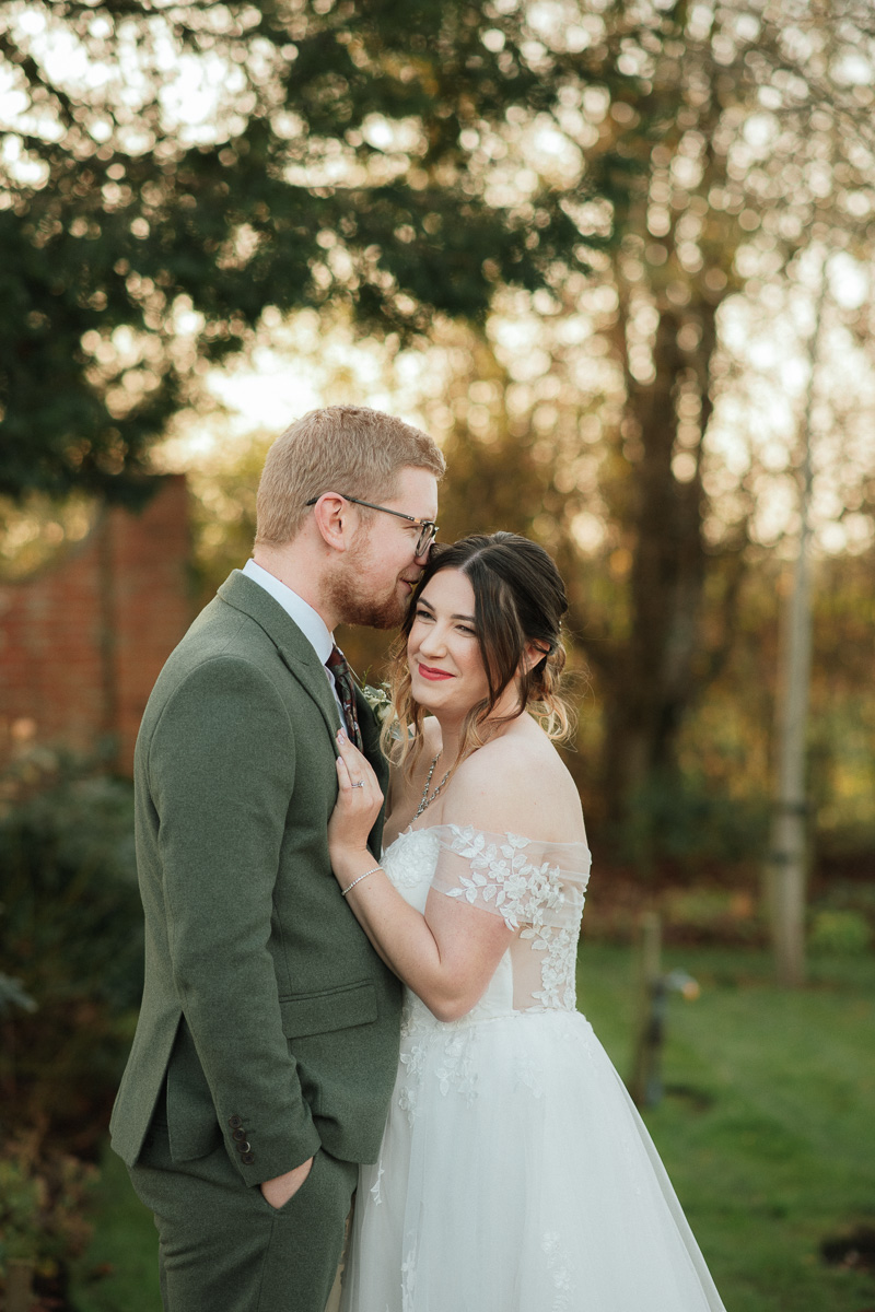 Wedding Photographer in Wiltshire, the Cotswolds, Gloucestershire and beyond. bride and groom share an intimate moment after their micro wedding ceremony at syrencot house