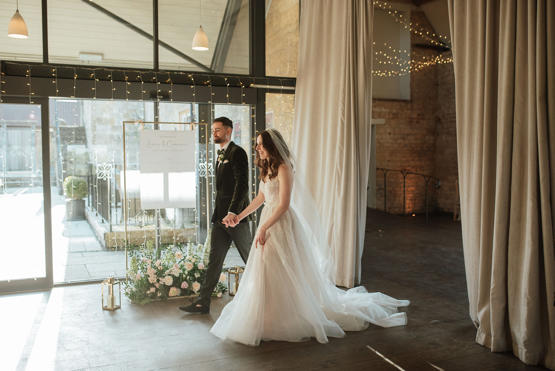 bride and groom entering their wedding breakfast after a micro wedding ceremony at lapstone barn