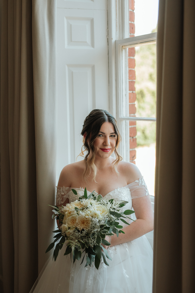bride sat in the window of the bridal suite at syrencot house