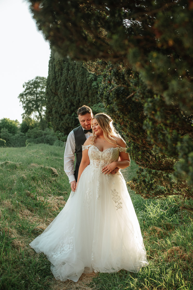 bride and groom sharing an intimate moment during golden hour in Wiltshire 