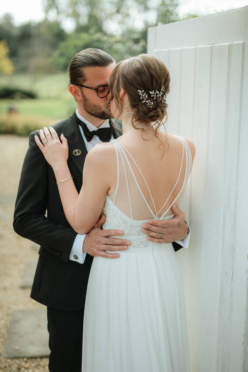 romantic bride and groom portrait at golden hour, intimate wedding photography with soft natural light.