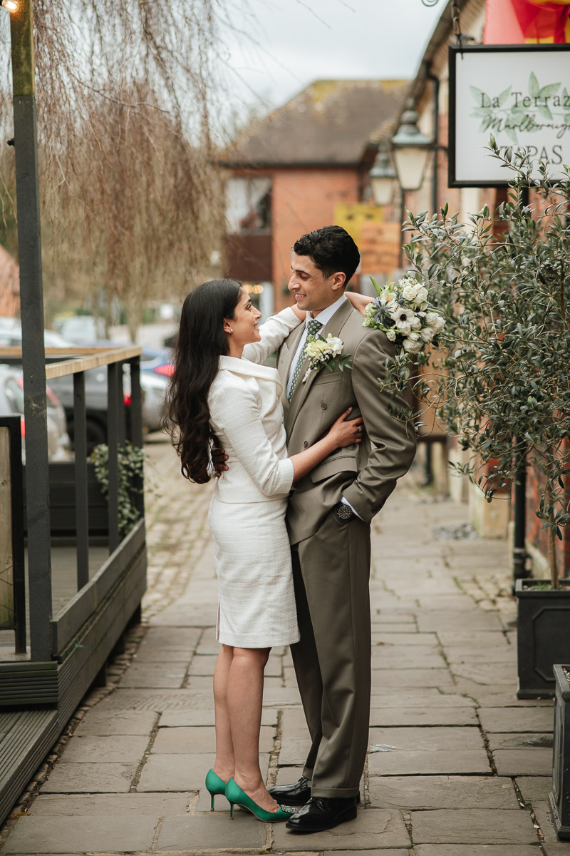 Wedding Photographer in Wiltshire bride and groom share an intimate moment after their micro wedding in Marlborough town hall