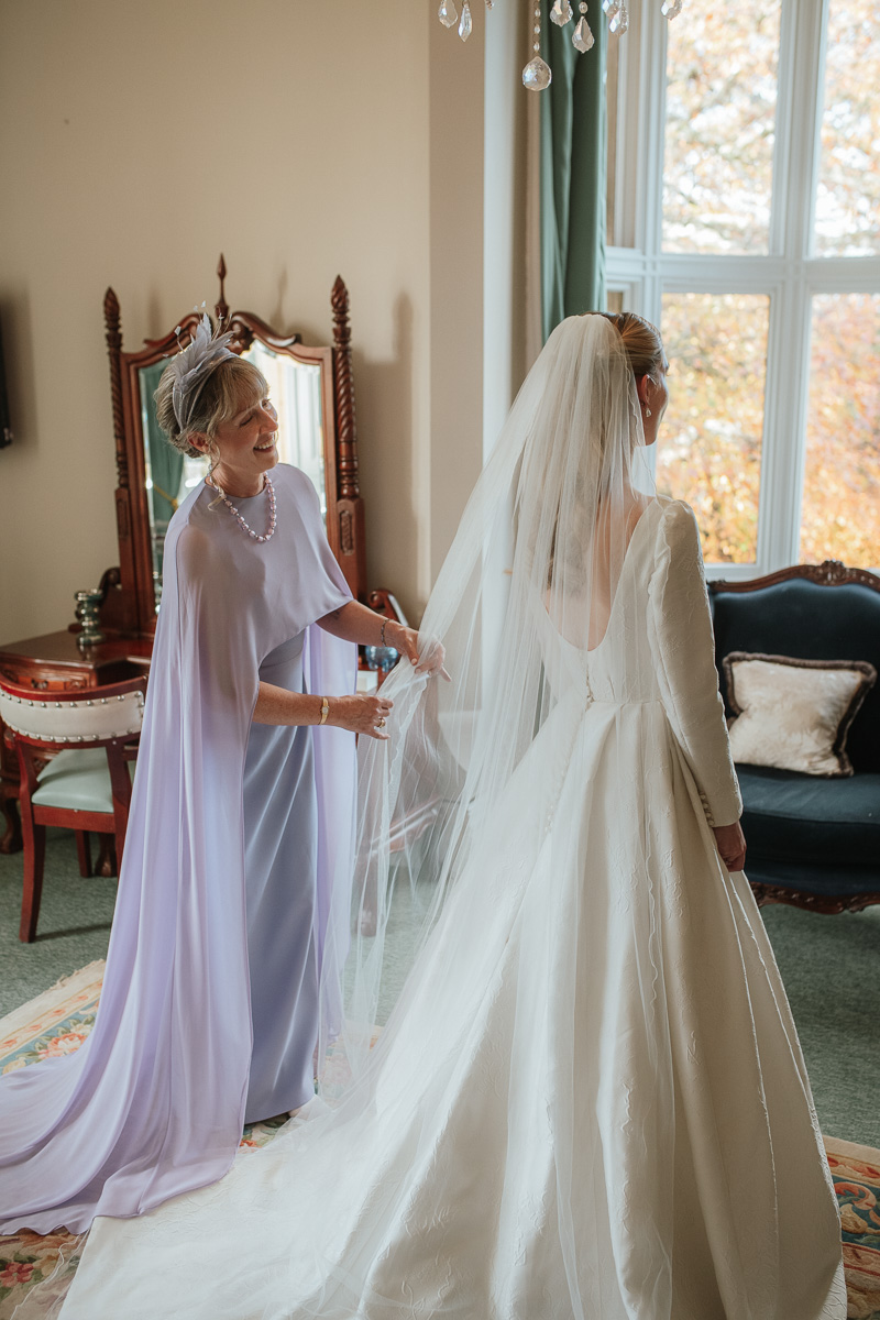 Bride with mother before wedding ceremony at orchardleigh estate