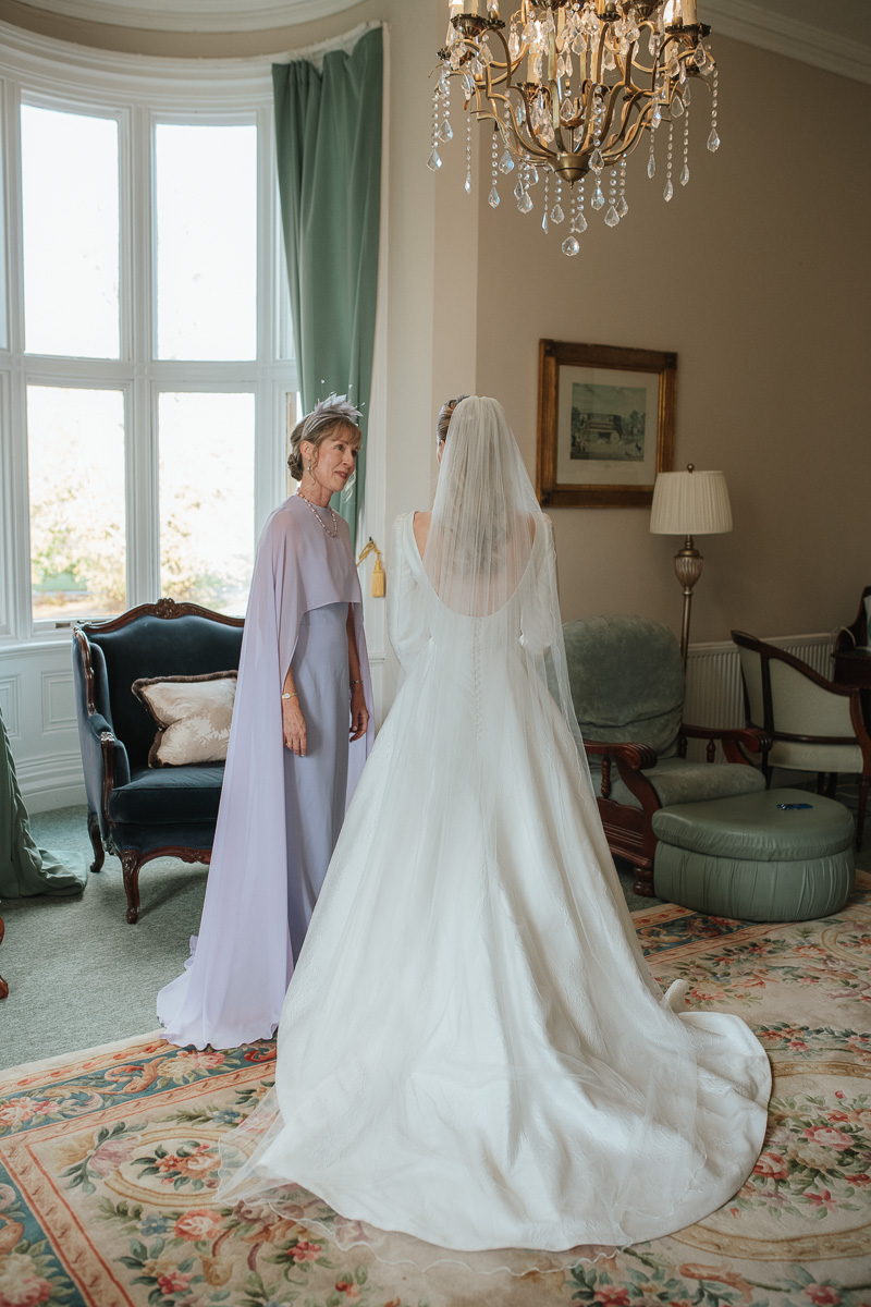 Bride with mother before wedding ceremony at orchardleigh estate