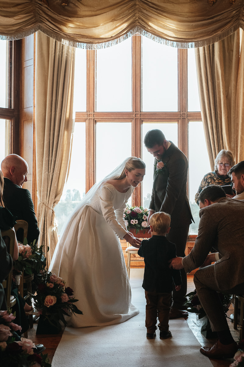 Ring bearer carrying rings at Orchardleigh Estate wedding