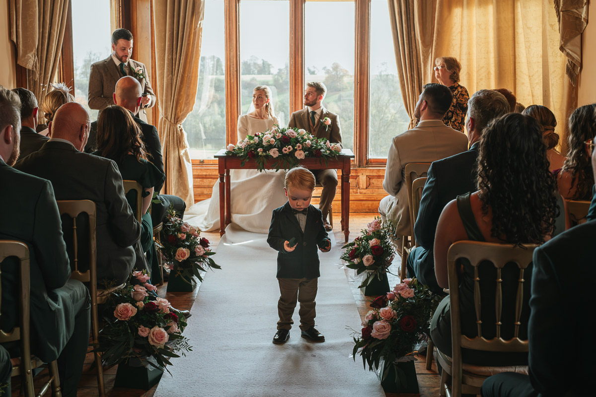 Ring bearer carrying rings at Orchardleigh Estate wedding
