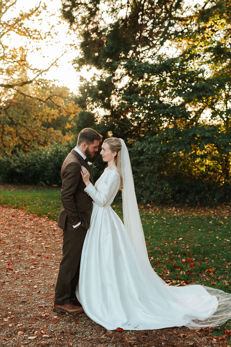 Bride and groom in winter sunshine at Orchardleigh Estate