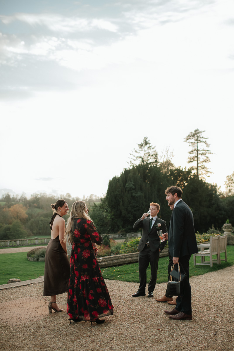 guests mingling outside during a winter wedding at orchardleigh estate