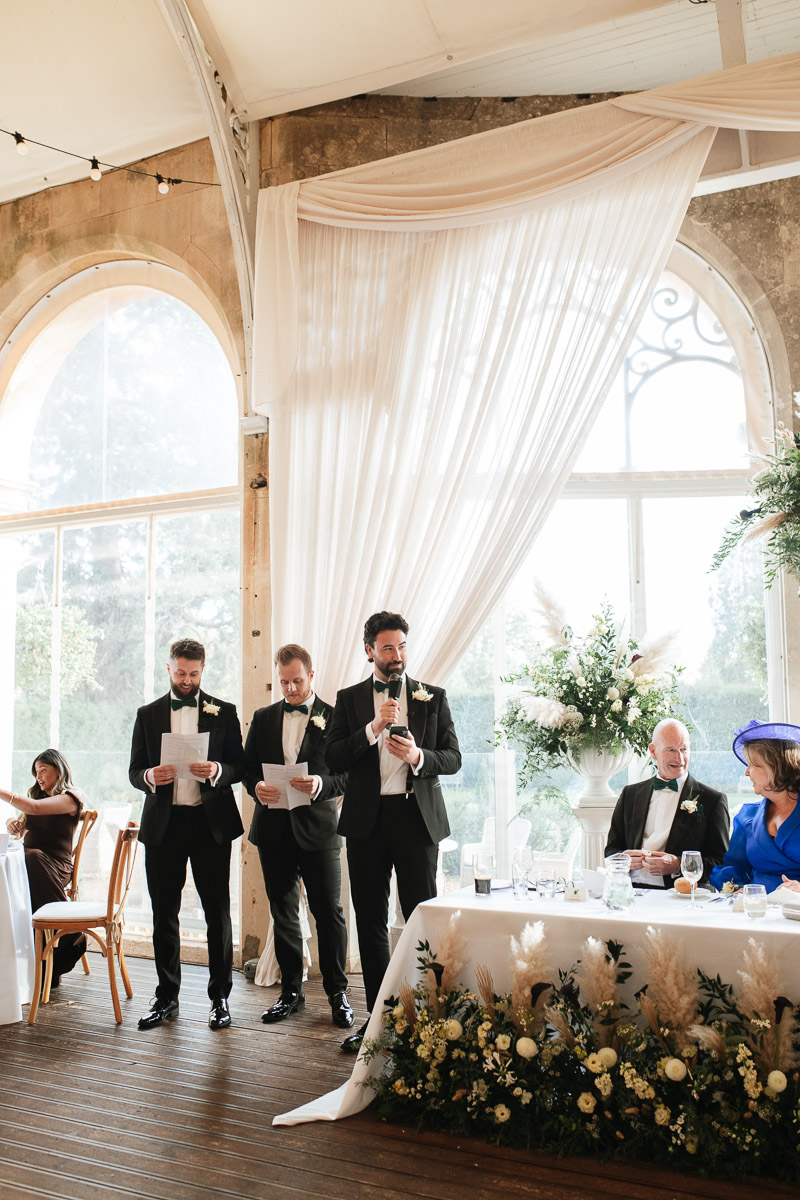 best men doing their speeches together during wedding at grittleton house
